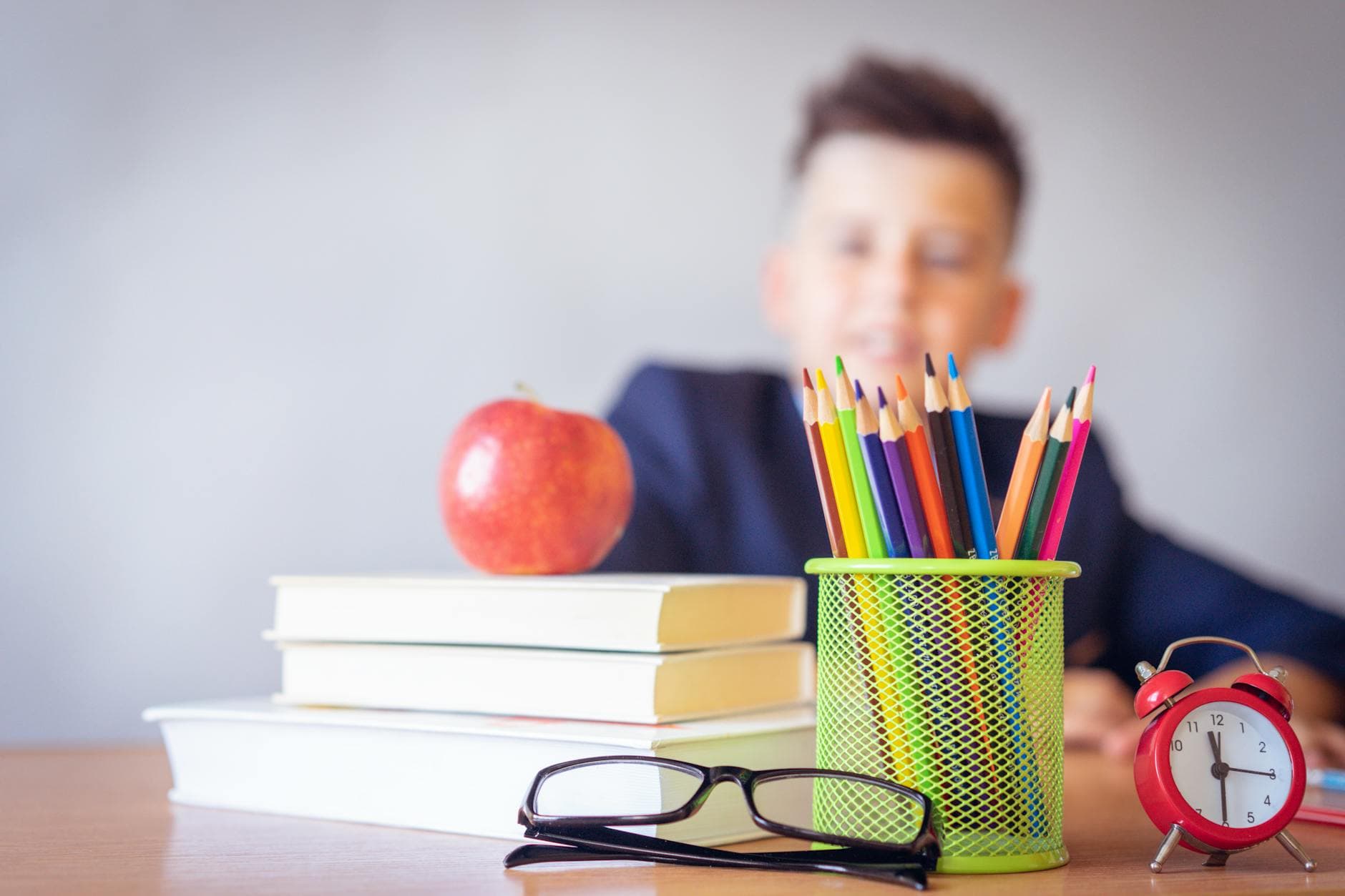 Schoolboy with books and learning materials